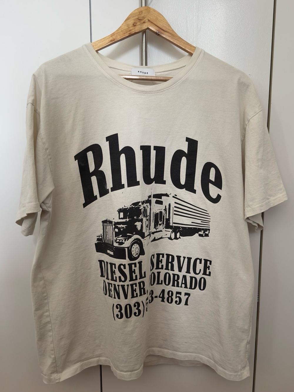 Rhude Cream Short Sleeve Tee with Black Truck Graphic